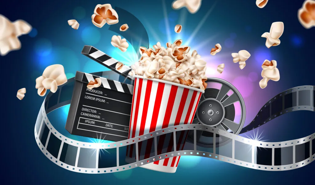 Movie theater popcorn bucket with film reel, clapperboard, and popcorn kernels floating against blue gradient background